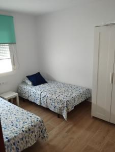 Postel nebo postele na pokoji v ubytování Casa juani