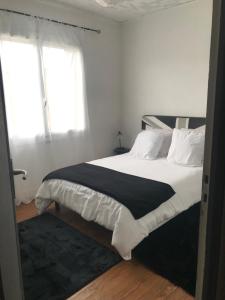 Ένα ή περισσότερα κρεβάτια σε δωμάτιο στο Appartement spacieux et lumineux