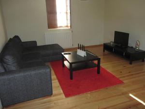a living room with a couch and a coffee table at Casa do Villas in Castelo de Paiva +13 photos
