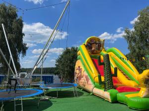 uno scivolo d'acqua gonfiabile su una nave da crociera di Family & Business Sauna Apartments No3 Leśny nad Zalewem Cedzyna - 2 Bedroom with Private Sauna, Bath with Hydromassage, Terrace, Parking, Catering Options a Kielce