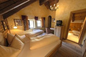 TV a/nebo společenská místnost v ubytování Landhaus Wastlalm - mit gratis Eintritt in SPA Bereich