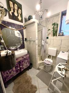 a bathroom with a sink and a toilet and a tub at Nomi Dream Box in Split +18 photos