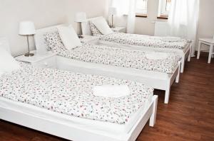 Postel nebo postele na pokoji v ubytování Pokoje Gościnne Ruciane-Nida