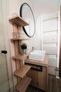 a bathroom with a sink and a mirror at Nivalis Residence Jahorina in Jahorina +50 photos