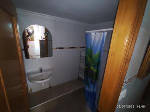 a bathroom with a sink and a mirror at Apartamento Premium Relax D in Cicero +27 photos