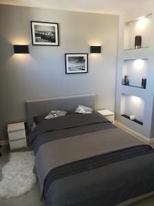 Katil atau katil-katil dalam bilik di Apartament GREY Świnoujście bezpłatny parking
