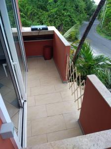 an outside view of a balcony with a patio at Stephane in Pointe-Noire