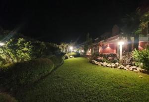 a yard at night with a house and lights at EDEN RELAX in Termoli