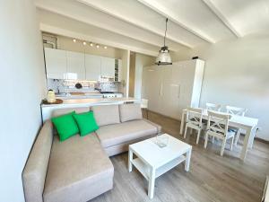 a living room with a couch and a table at Maison Mazzini48 in Rapallo