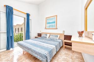 Postel nebo postele na pokoji v ubytování DUPLEX en PARAÍSO