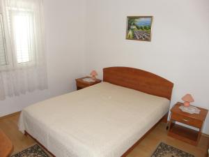 Postel nebo postele na pokoji v ubytování Apartments Veronika
