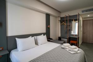Postel nebo postele na pokoji v ubytování Argo Hotel Piraeus + 37 fotografií