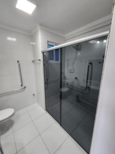 a bathroom with a shower and a toilet at Spazzio diRoma - Apartamentos JN in Caldas Novas