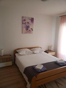 Posteľ alebo postele v izbe v ubytovaní Apartmani Čiklić