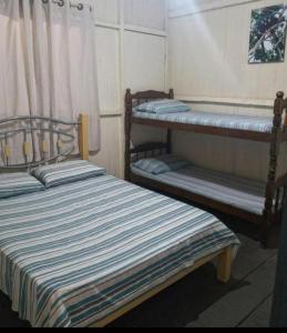 Un pat sau paturi într-o cameră la Spot Jaguar Pantanal South Lodgen