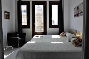 Cama o camas de una habitación en Torres de Valencia Apartments