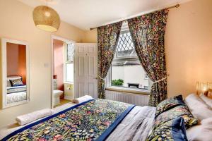 a bedroom with a bed and a window at Austin Terrace in Gorleston-on-Sea