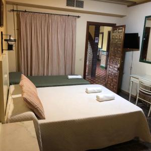 Posteľ alebo postele v izbe v ubytovaní Hotel Molino De Saydo