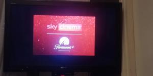 a television screen with a sign that says sky channel at Alle Vigne 5 in Brunate