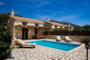 a villa with a swimming pool in front of a house at Ivi Villa in Sivota