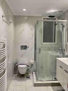 a bathroom with a shower and a toilet at Luxury spacious apartment in the heart of the city in Rhodes Town