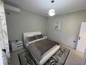 Кровать или кровати в номере Manga Luxury Apartments