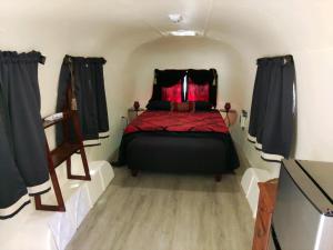 a bedroom with a bed in a small room at Oak Knoll Village in Palomar Mountain