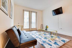 a living room with a couch and a table at Luxury by the Pool in Lawrenceville