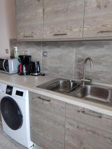 Kuchyň nebo kuchyňský kout v ubytování SEA VIEW APARTMENTS Zeus + 13 fotografií