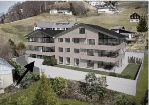 una vista aérea de una gran casa en una colina en Triesenberg, en Triesenberg