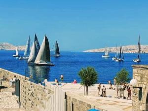 a group of sail boats in a body of water at Lana 1 in Senj
