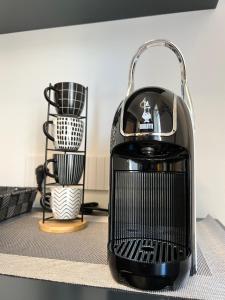 a black heater sitting on top of a table at Residenza Diaz in Domodossola