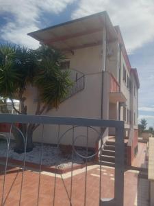 a building with a staircase in front of it at VILLA PARADISO TAVERNETTA in Scanzano