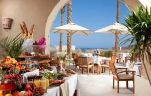a buffet of food on a table in a restaurant at Azzurra Sahl Hasheesh in Hurghada