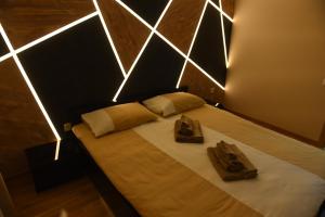 Postel nebo postele na pokoji v ubytování Premium Lux Apartman Čačak