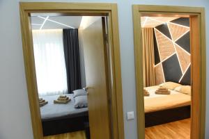 Postel nebo postele na pokoji v ubytování Premium Lux Apartman Čačak