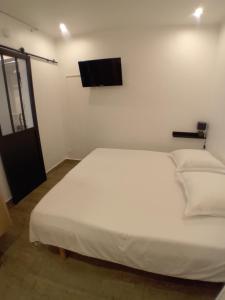 Postel nebo postele na pokoji v ubytování 11 Rue Vauban