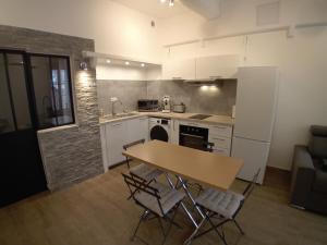 Kuchyň nebo kuchyňský kout v ubytování 11 Rue Vauban