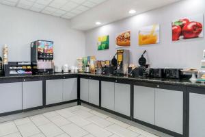 a fast food restaurant with a counter with food at Quality Inn & Suites Banquet Center in Livonia