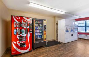 a room with a cocacola soda machine and a refrigerator at Extended Stay America Suites - Akron - Copley - East in Copley