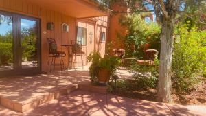 a front porch of a house with a table and chairs at Casa Sedona Inn in Sedona