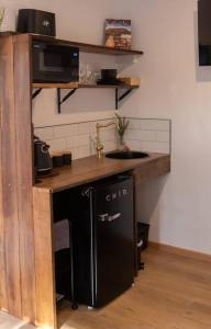 a kitchen with a sink and a counter with a sinkessment at Burnie Unit - The Cape in Burnie