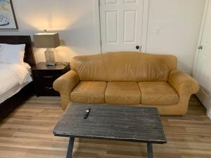 a living room with a couch and a coffee table at Country studio pet friendly in Port Alberni