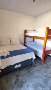Een bed of bedden in een kamer bij Pousada Siriba