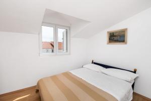 Tempat tidur dalam kamar di Apartment Marijana