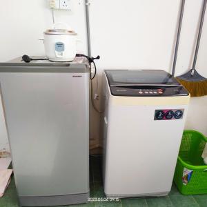 two machines are next to each other in a room at Homestay Kasturi Teluk Kalong Kemaman in Kijal