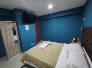 Postel nebo postele na pokoji v ubytování Inti Llaqta Hotel & Suites