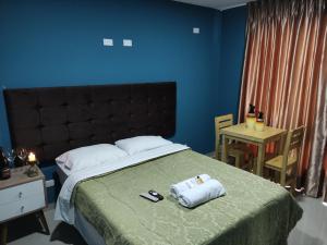 Postel nebo postele na pokoji v ubytování Inti Llaqta Hotel & Suites