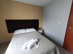 Postel nebo postele na pokoji v ubytování Inti Llaqta Hotel & Suites