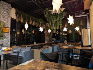 a restaurant with tables and chairs and stars on the wall at Hide and Sea at Green Island in Green Island
